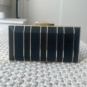 NWT BCBG MaxAzria Clutch with gold chain. Dust bag included